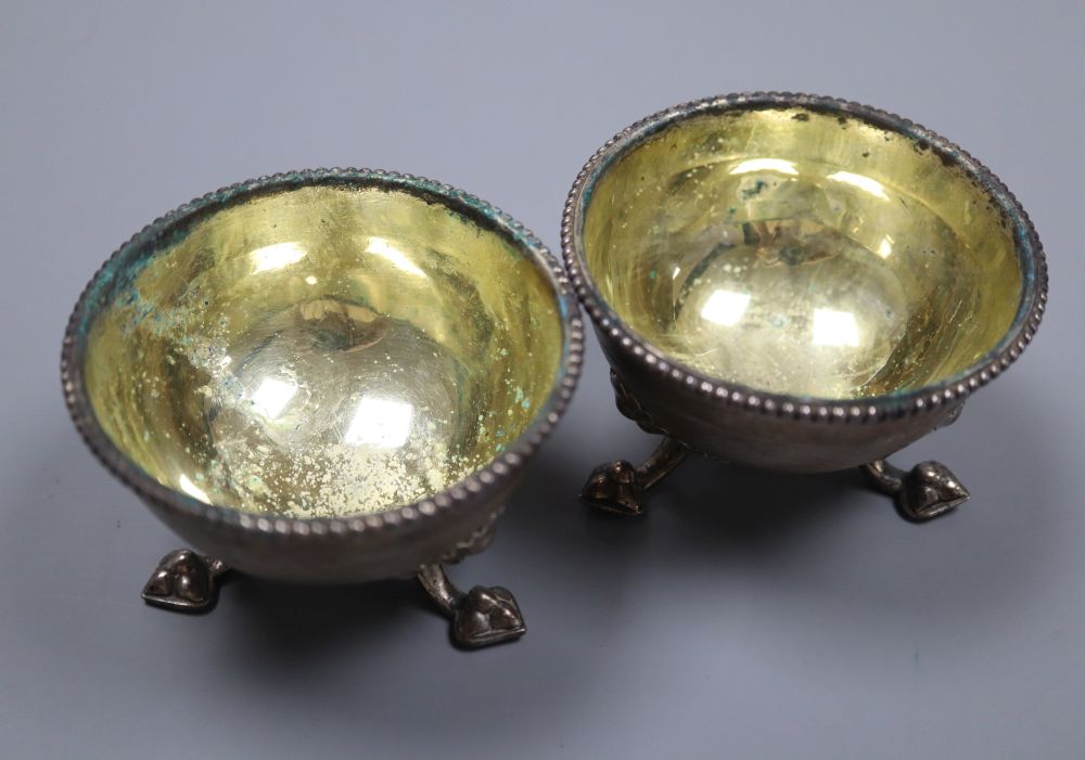 A pair of Victorian silver salts by Hunt & Roskell, London, 1864, diameter 78mm, 8oz, lacking one later liner.